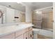 Bathroom with vanity, sink, and bathtub with shower, designed for comfort and utility at 3662 S Granby Way # J05, Aurora, CO 80014