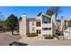 Attractive condo building showcasing a modern design with a well-maintained yard and mature trees at 3662 S Granby Way # J05, Aurora, CO 80014