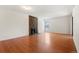 Large living room featuring a decorative fireplace and hardwood floors at 3662 S Granby Way # J05, Aurora, CO 80014