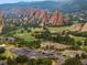 Panoramic view of Arrowhead Golf Club, scenic rock formations, and residential community at 6338 Spotted Fawn Run, Littleton, CO 80125