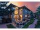 Charming backyard with a fire pit and stone patio, ideal for outdoor entertainment and relaxation at 6338 Spotted Fawn Run, Littleton, CO 80125
