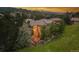Aerial view of backyard patio with firepit, and two story windows with views of the mountains at 6338 Spotted Fawn Run, Littleton, CO 80125