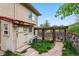 Backyard shed and chicken coop area perfect for gardening and animal enthusiasts at 6338 Spotted Fawn Run, Littleton, CO 80125