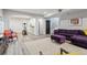 Spacious basement with workout area, comfortable seating, and modern flooring at 6338 Spotted Fawn Run, Littleton, CO 80125