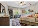 Cozy bedroom featuring plush bedding, desk, and unique decor with window views at 6338 Spotted Fawn Run, Littleton, CO 80125