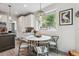 Bright breakfast nook featuring a marble table and a large window with a view at 6338 Spotted Fawn Run, Littleton, CO 80125