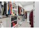 Organized walk-in closet with shelves and hanging rods at 6338 Spotted Fawn Run, Littleton, CO 80125