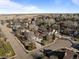 An aerial view of homes in a well-planned neighborhood with mature trees and easy access to nearby fields at 7202 Snow Peak Ct, Niwot, CO 80503