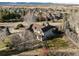 Lovely aerial view of a suburban home with a spacious backyard and a well-maintained fence and garden at 7202 Snow Peak Ct, Niwot, CO 80503