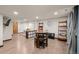Finished basement features vinyl floors, a game table, and exercise area at 7202 Snow Peak Ct, Niwot, CO 80503