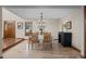 Formal dining room with elegant chandelier, hardwood floors, and stylish furniture, perfect for entertaining guests at 7202 Snow Peak Ct, Niwot, CO 80503