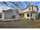 Inviting two-story home with a combination of brick and siding, plus lush landscaping enhancing curb appeal at 7202 Snow Peak Ct, Niwot, CO 80503