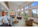 Bright and airy living room with large windows and an open floor plan, perfect for comfortable living and entertaining at 7202 Snow Peak Ct, Niwot, CO 80503