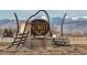 The vintage 'Niwot' sign welcomes visitors with a backdrop of the Rocky Mountains at 7202 Snow Peak Ct, Niwot, CO 80503