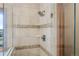 Close up of a shower features detailed tile and glass surround at 7202 Snow Peak Ct, Niwot, CO 80503