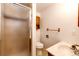 Bathroom featuring enclosed shower, toilet, vanity and fixtures at 3125 W Ford Pl, Denver, CO 80219