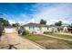 Single-story home with an extended driveway, tidy landscaping, and classic curb appeal at 3125 W Ford Pl, Denver, CO 80219