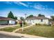 Cozy single-story home with a well-kept lawn and a 'For Sale' sign in the yard at 3125 W Ford Pl, Denver, CO 80219