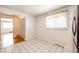 Bright and airy kitchen boasting tile floors with adjacent dining area with hardwood at 3125 W Ford Pl, Denver, CO 80219
