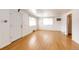 Inviting living room featuring white walls and light hardwood floors with natural light at 3125 W Ford Pl, Denver, CO 80219