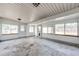 Spacious sunroom with multiple windows offering lots of natural light at 3125 W Ford Pl, Denver, CO 80219