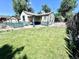 Spacious, enclosed backyard with a grassy lawn perfect for outdoor activities and relaxation at 1270 Havana St, Aurora, CO 80010