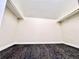 Walk-in closet has carpet, white walls, base trim, and top shelving to maximize space at 1270 Havana St, Aurora, CO 80010