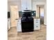 New kitchen with black range at 1270 Havana St, Aurora, CO 80010