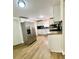 Updated kitchen with stainless steel refrigerator, countertops, and wooden floors at 1270 Havana St, Aurora, CO 80010