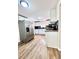 Updated kitchen with stainless steel refrigerator, countertops, and wooden floors at 1270 Havana St, Aurora, CO 80010