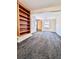 Inviting living room with unique carpet, and bookshelf makes a comfortable living space at 1270 Havana St, Aurora, CO 80010