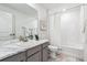 Bathroom vanity with a marble countertop, a sink, and a mirror at 718 176Th Ave, Broomfield, CO 80023