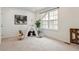 A light and airy bedroom featuring neutral decor, large window, and playful teepee at 718 176Th Ave, Broomfield, CO 80023