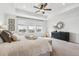 Bright main bedroom with large windows, carpeted floors, and elegant decorations at 718 176Th Ave, Broomfield, CO 80023