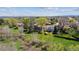 Aerial view of the community, showcasing the homes and lush green spaces surrounded by mature trees at 6336 S Newland Ct, Littleton, CO 80123