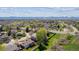 Overhead view showcasing the community's layout, complete with tree-lined streets and mountain views in the distance at 6336 S Newland Ct, Littleton, CO 80123