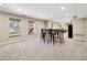 Finished basement with a table and chairs; features carpeted flooring at 6336 S Newland Ct, Littleton, CO 80123
