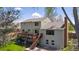 Charming home with a large wooden deck overlooking a well-manicured backyard, perfect for outdoor living and entertaining at 6336 S Newland Ct, Littleton, CO 80123
