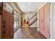 Entryway with beautiful tile flooring and a view of the staircase at 6336 S Newland Ct, Littleton, CO 80123