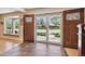 Bright foyer with tile flooring and a view of the front yard and neighborhood at 6336 S Newland Ct, Littleton, CO 80123