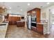 Spacious kitchen with stainless steel appliances, granite countertops, and custom cabinetry at 6336 S Newland Ct, Littleton, CO 80123