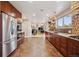 Open kitchen view into a spacious living room with hardwood floors and modern decor at 6336 S Newland Ct, Littleton, CO 80123