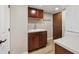 Functional laundry room with cabinetry, a sink, and convenient access to appliances at 6336 S Newland Ct, Littleton, CO 80123