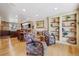 Open-concept space with living room, dining area, and kitchen, featuring hardwood floors at 6336 S Newland Ct, Littleton, CO 80123