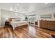 Spacious main bedroom with recessed lighting, a window seat and beautiful hardwood floors at 6336 S Newland Ct, Littleton, CO 80123