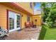 Cozy backyard deck featuring an outdoor dining set, fire pit, and manicured lawn at 3201 W 126Th Ave, Broomfield, CO 80020