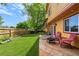 Well-maintained backyard featuring a manicured lawn and a patio with a fire pit at 3201 W 126Th Ave, Broomfield, CO 80020