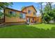 Spacious backyard showcasing a large lawn area and a charming outdoor seating area at 3201 W 126Th Ave, Broomfield, CO 80020