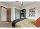 Bedroom featuring a cozy bed next to a window, creating a bright and inviting space at 3201 W 126Th Ave, Broomfield, CO 80020