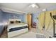 Comfortable bedroom with soft carpet, natural light, and a neutral color palette at 3201 W 126Th Ave, Broomfield, CO 80020